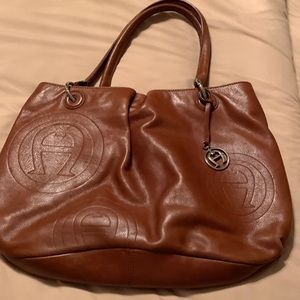Brown leather purse 17 inches wide and 11 inches tall.